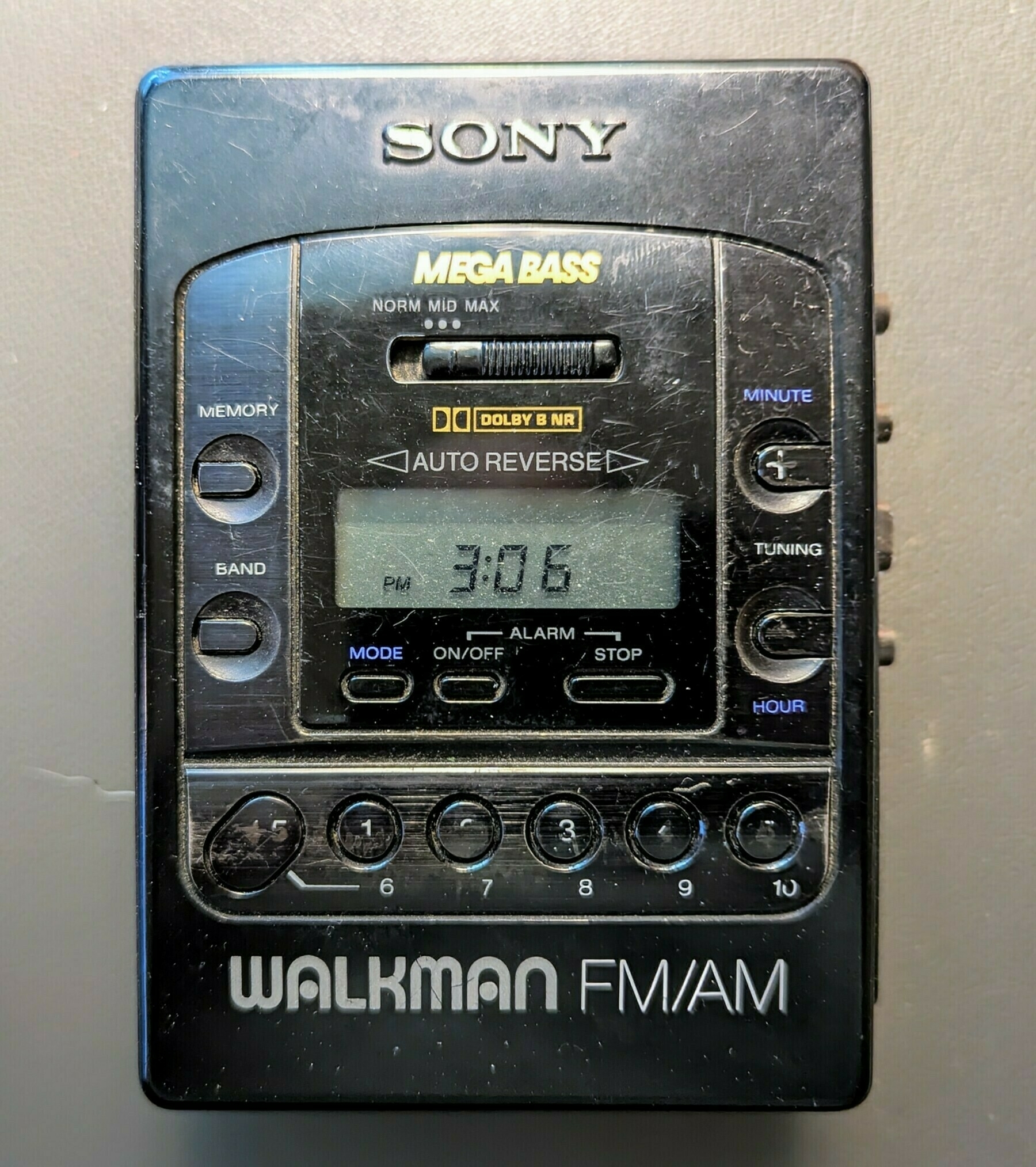 A vintage Sony Walkman FM/AM radio with a digital display